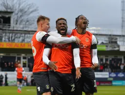 Kazenga LuaLua celebrates giving the Hatters an early lead in the match