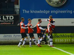 Harry Cornick celebrates making it 3-2 late on in the match