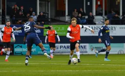 Luke Berry charging over the halfway line, wrong footing Josh Onomah