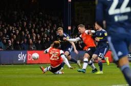 Kazenga LuaLua gets low to open up the scoring in the 5th minute