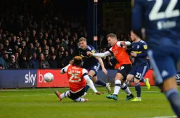 Kazenga LuaLua gets low to open up the scoring in the 5th minute