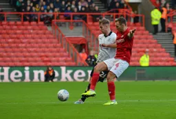 James Bree sending in a cross with Ádám Nagy trying to challenge