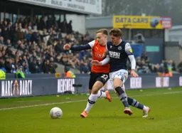Luke Bolton battles with Connor Mahoney on the right wing