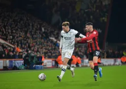 Harry Cornick tries to get away from Diego Rico on the wing