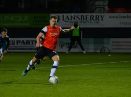 James Collins dispatches the penalty, levelling the game at 1-1