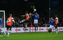 Matty Pearson misses his header and Lee Camp punches clear