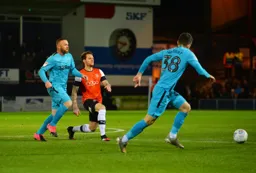 Wayne Rooney is left chasing shadows as Glen Rea plays a square ball