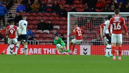 Simon Sluga gathers at the feet of Ashley Fletcher