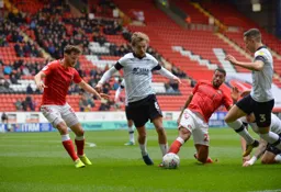 Luke Berry and Dan Potts go hunting for the ball with future Hatter Tom Lockyer ready to enter the fray