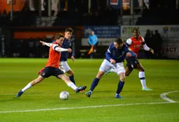 Luke Berry trying to get the better of Henrik Dalsgaard and put the ball in the box