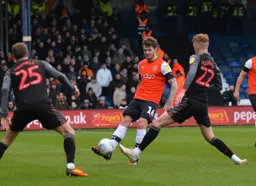 Glen Rea dinks on through the Stoke midfield