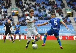Glen Rea breezes past Sam Morsy in the middle of the park