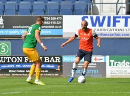 Danny Hylton stands up Patrick Bauer to try work the ball into the box