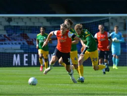 Harry Cornick is fouled as he brings the ball away from Tom Barkhuizen