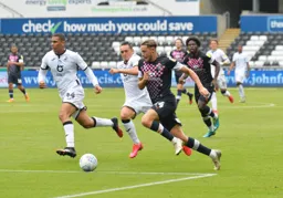 Harry Cornick gets behind the Swansea defence and bursts into the penalty box