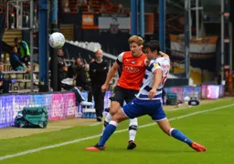 James Collins is beaten to the ball
