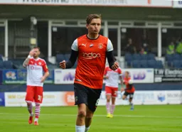 Luke Berry puts the Town ahead in the 13th minute