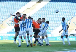 Sonny Bradley rises highest to head in from a corner, putting the Town 1-0 ahead