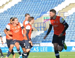 Sonny Bradley wheels away after giving Luton Town the lead