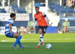 Andrew Shinnie passes around Luke Amos