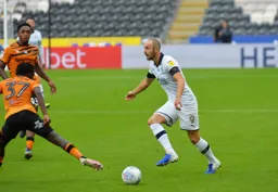 Danny Hylton tries to get the better of Leonardo Da Silva Lopes