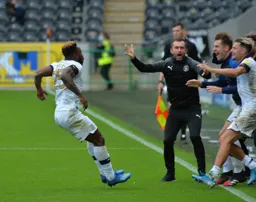 Kazenga LuaLua celebrates with the squad, they all know how vital this goal is