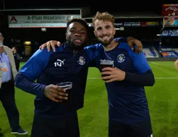 Kazenga LuaLua and Andrew Shinnie toast Championship survival