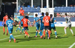 Sonny Bradley heads the ball into the danger area