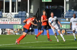 Jordan Clark`s diving header gives the Town a late winner