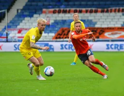 Jordan Clark uses a body swerve to go clear