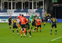 Simon Sluga in the City penalty area gets in a header at goal