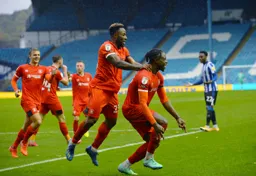 Pelly-Ruddock Mpanzu celebrates his goal with Kazenga LuaLua