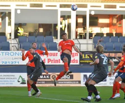 Matt Pearson goes up for a header