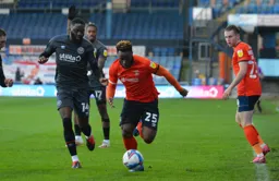Kazenga LuaLua keeps his eyes on the ball