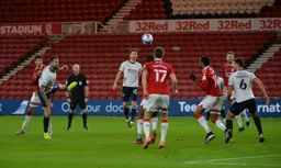 Sonny Bradley attempts a header at goal
