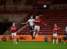 Glen Rea heads the ball clear from George Saville