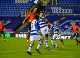 Danny Hylton and future Hatter Tom Holmes challenge for a high ball