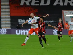 Danny Hylton makes life uncomfortable for Lloyd Kelly