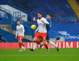 Sonny Bradley holds off Olivier Giroud