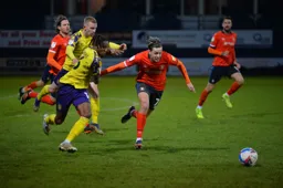 Harry Cornick in a race for the ball