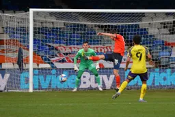 Tom Lockyer makes a solid clearance
