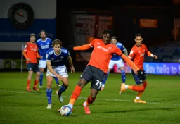Elijah Adebayo looks to pass the ball