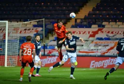 Sonny Bradley heads the ball clear