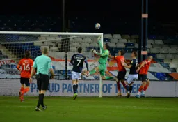 Simon Sluga has to deal with an awkward cross to the back post