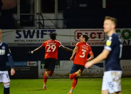 Elijah Adebayo is off to celebrate his goal with Dan Potts