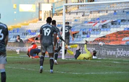 The ball nestles in the net after Elijah Adebayo had headed in Town`s third goal