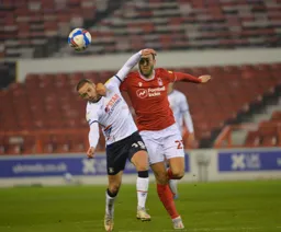 Arms every where as Jordan Clark and Joe Lolley challenge for the ball