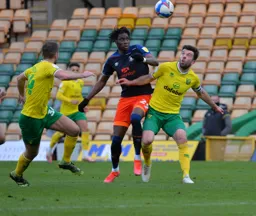 Elijah Adebayo heads the ball forward