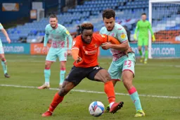 Kazenga LuaLua wrestles for the ball with Joel Latibeaudiere
