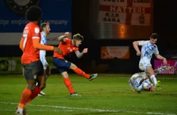 James Collins strikes a low shot towards goal